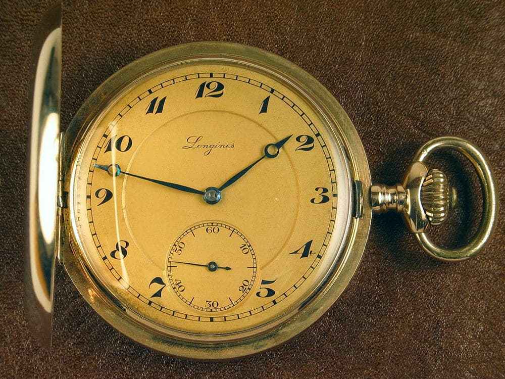 Longines Gold hunter-case pocket watch (champagne dial) 